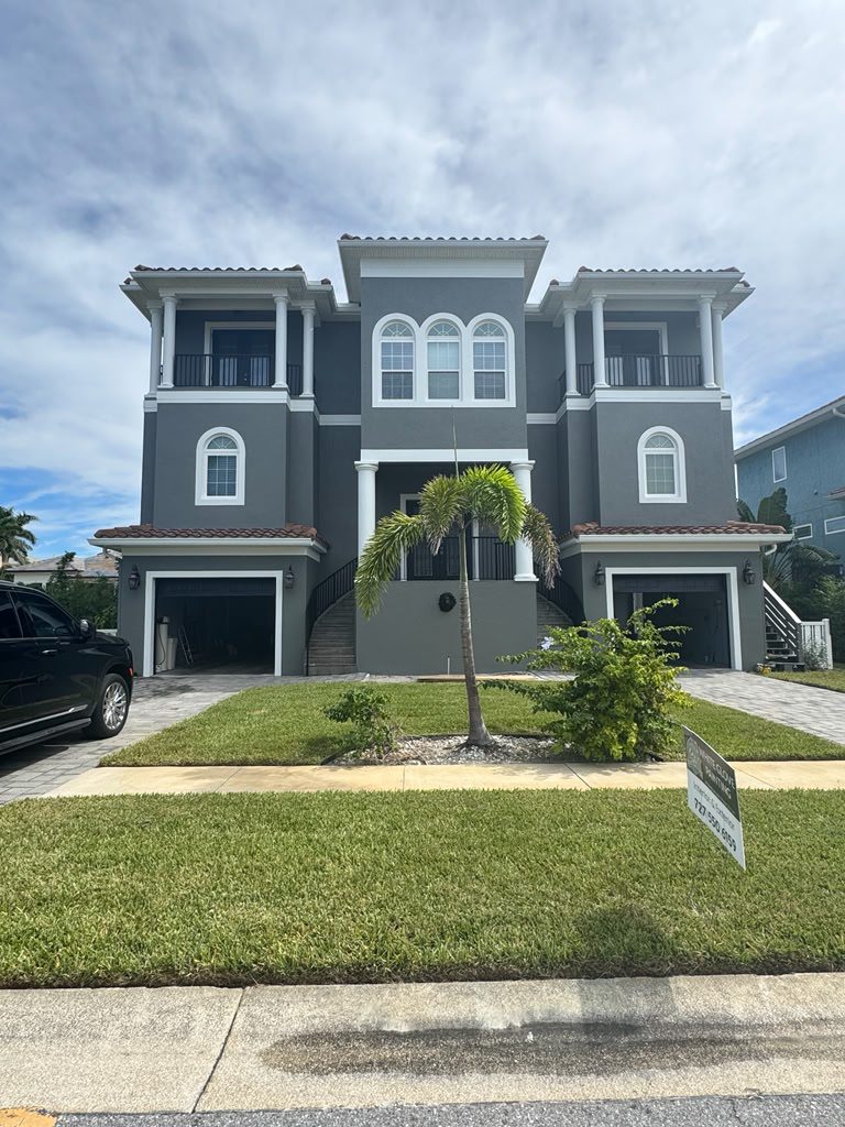 Professional painters in St. Petersburg FL completing a residential house painting project