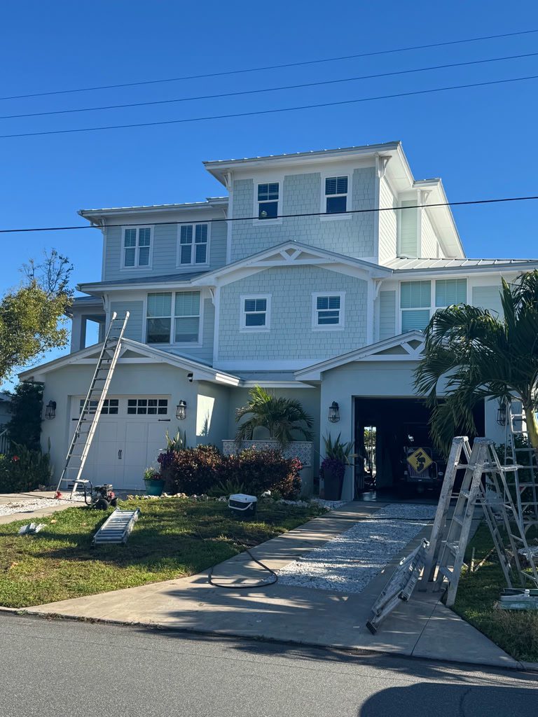 Professional painters in St. Petersburg FL completing a residential house painting project